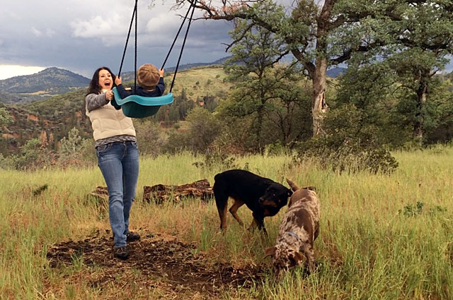 Kim plays with her nephew, Porter, as a thunderstorm approaches