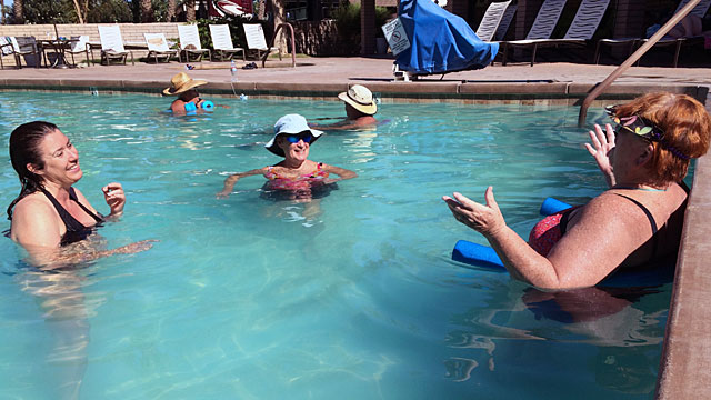 Kim and her new friends, joking in the pool