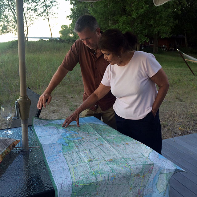 J.D. and Jo look at a map of the U.S.